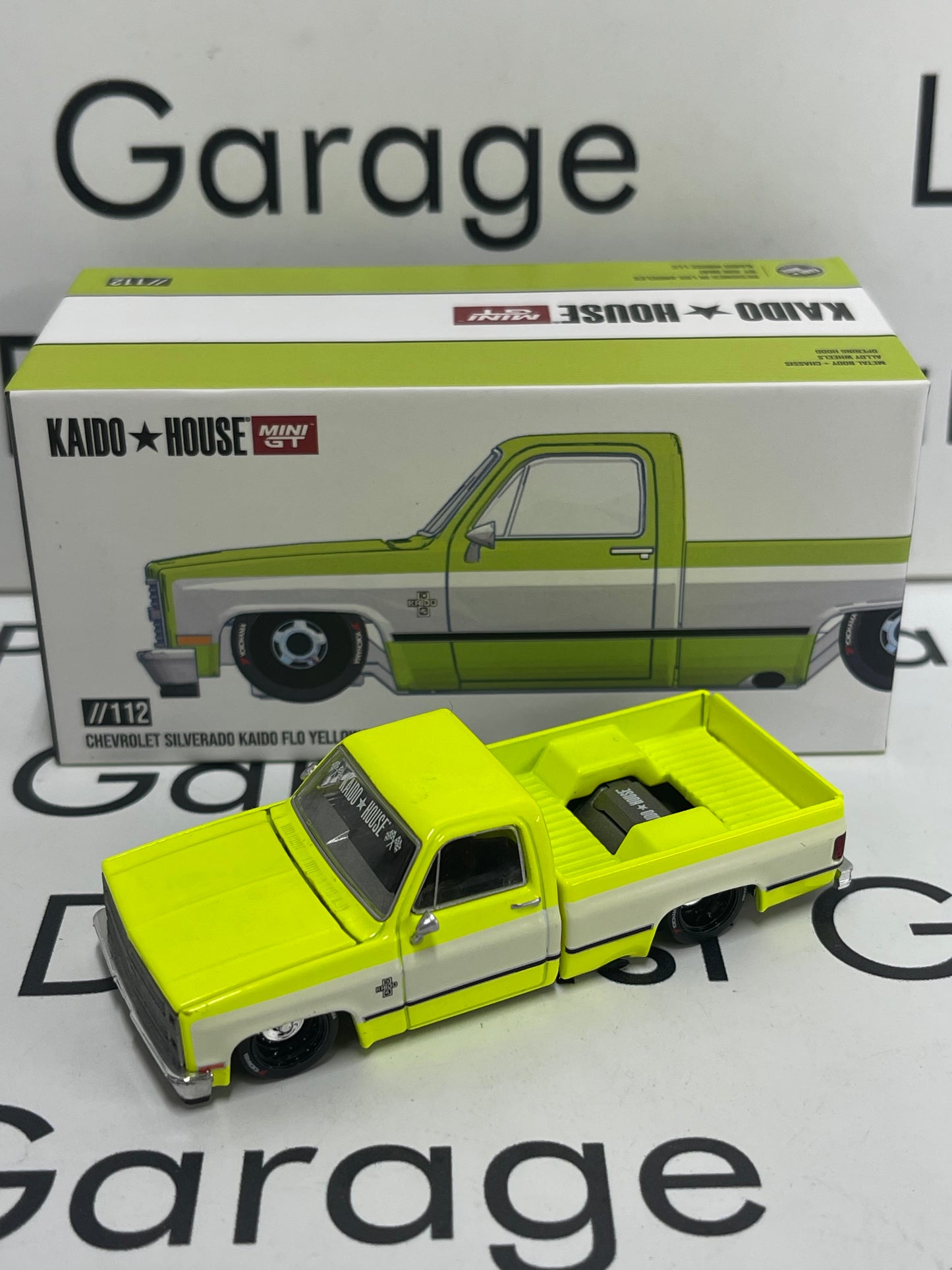 MINI GT Kaido House 1983 Chevrolet Silverado Kaido Flo V1 Yellow Truck 1:64 Diecast